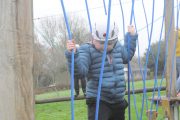 low level ropes course boy crossing stepping logs