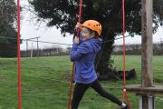 low level ropes course young girl ropes swing crossing