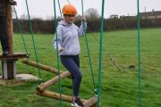 low level ropes course girl zig zag crossing